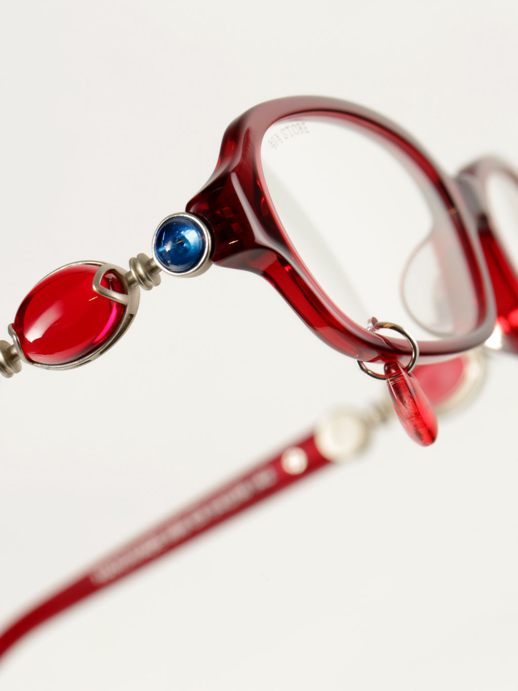 Bordeaux oval acetate glasses with vintage jeweled temple detailing